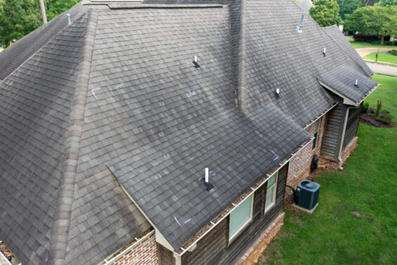Roof with hail damage and chalk markings from inspection